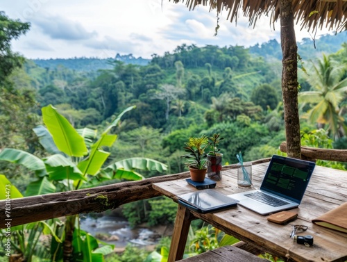 Tropical Jungle Workspace: Digital Nomads Working Remotely Amidst Lush Greenery, Scenic Landscape & Misty Mountains - Stock Photo