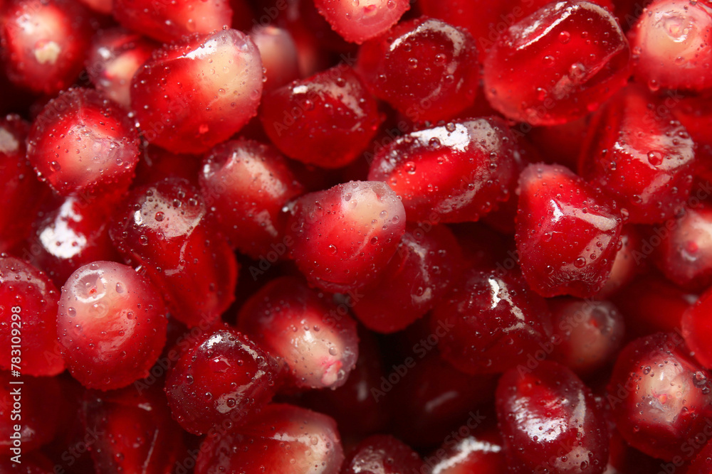 Ripe juicy pomegranate grains with water drops as background, top view Ripe juicy pomegranate grains with water drops as background, top view