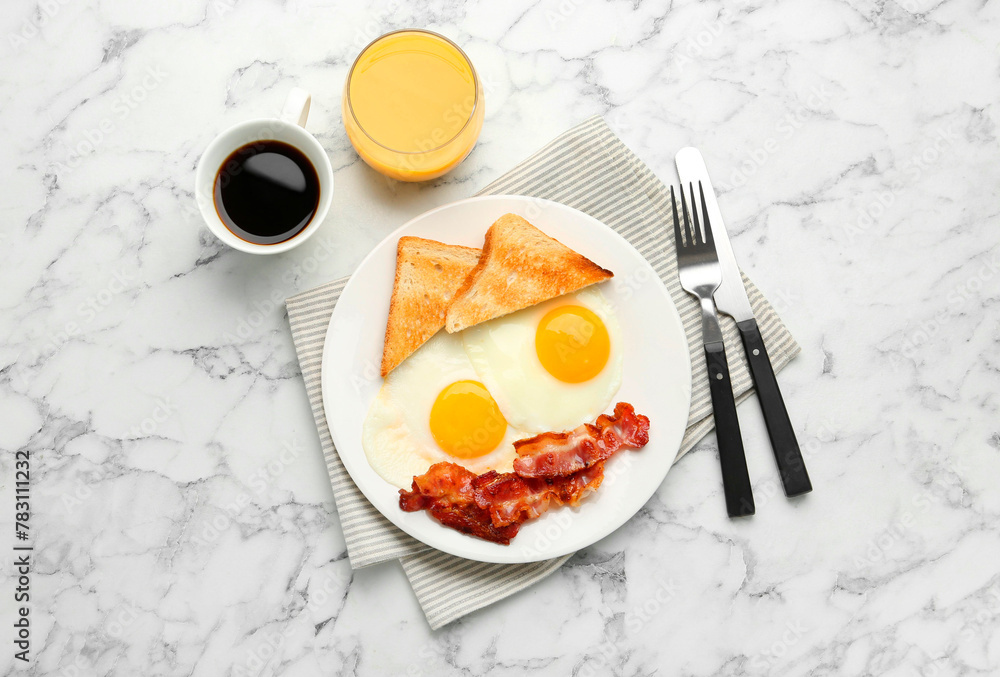 Delicious breakfast with sunny side up eggs served on white marble table, flat lay Delicious breakfast with sunny side up eggs served on white marble table, flat lay