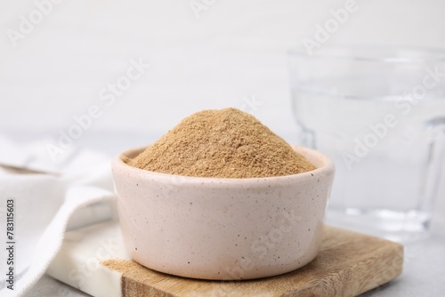 Dietary fiber. Psyllium husk powder in bowl on table