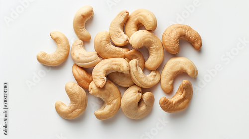 Roasted Cashew nuts in bowl isolated on white background with full depth of field. Top view with copy space for your text. Isolated roasted cashew nuts. Collection of roasted cashew nuts and halves.