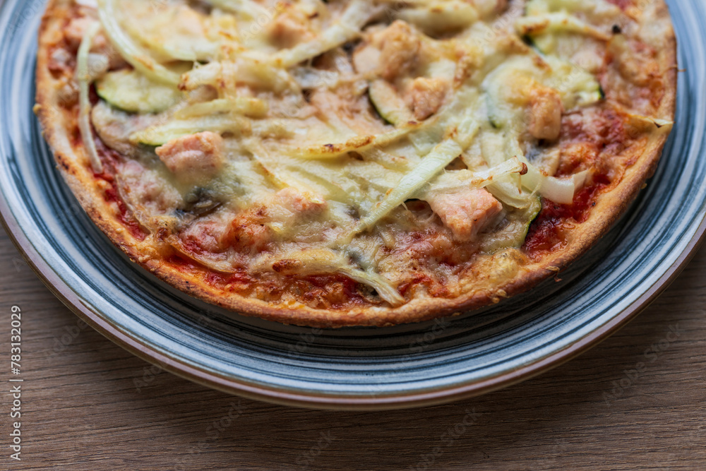 Italian homemade pizza with salmon and onions and parmesan, Italian cooking Italian homemade pizza with salmon and onions and parmesan, Italian cooking