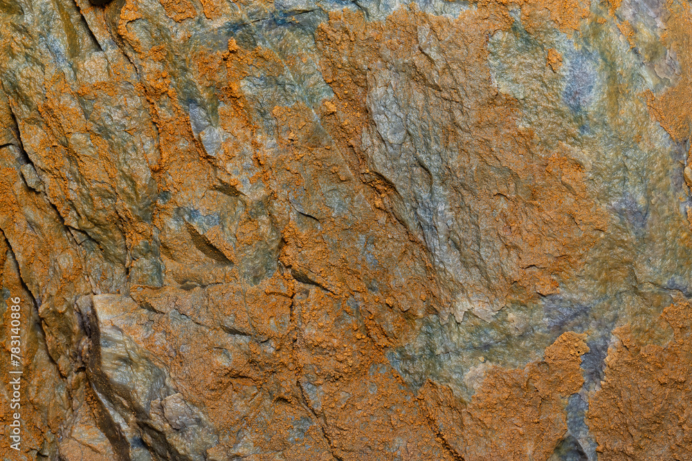 A close up shot of an rustic orange rock. A close up shot of an rustic orange rock.