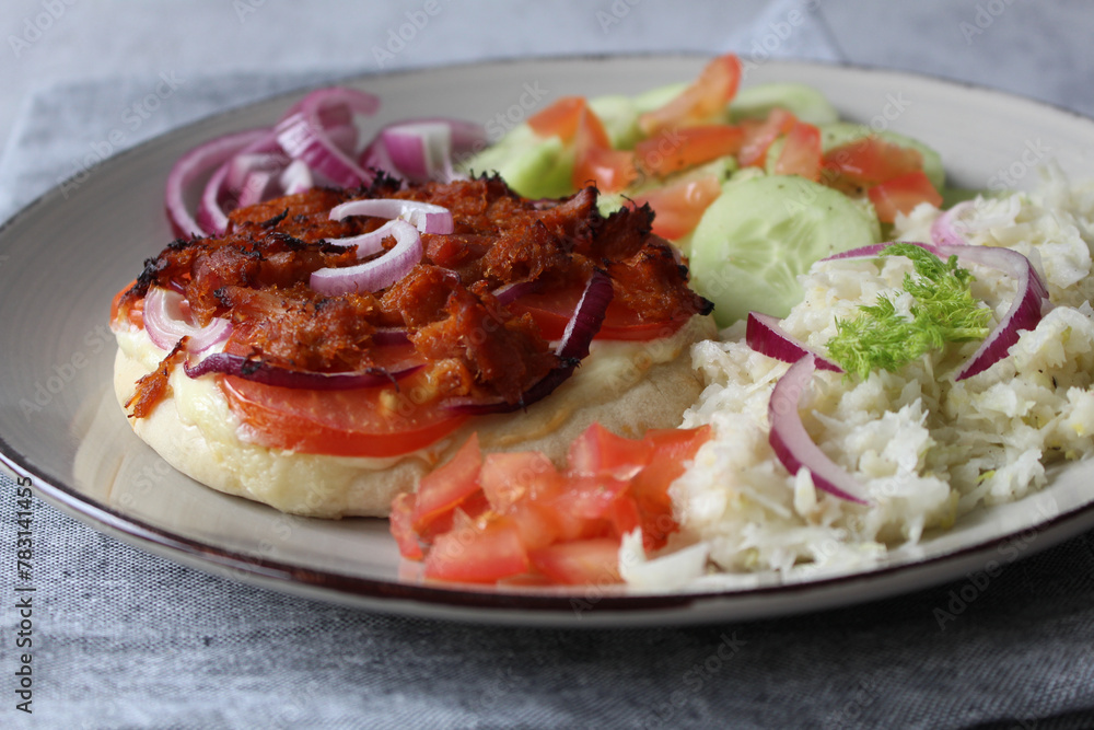 Ultimate Pulled Chicken Pita Pizza: Loaded with Tomatoes, Red Onions, and Crème Fraîche, Served with Fennel Salad and Cucumber Ultimate Pulled Chicken Pita Pizza: Loaded with Tomatoes, Red Onions, and Crème Fraîche, Served with Fennel Salad and Cucumber