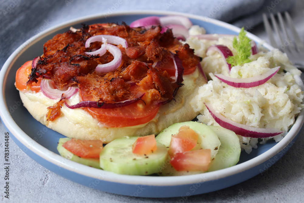 Ultimate Pulled Chicken Pita Pizza: Loaded with Tomatoes, Red Onions, and Crème Fraîche, Served with Fennel Salad and Cucumber Ultimate Pulled Chicken Pita Pizza: Loaded with Tomatoes, Red Onions, and Crème Fraîche, Served with Fennel Salad and Cucumber