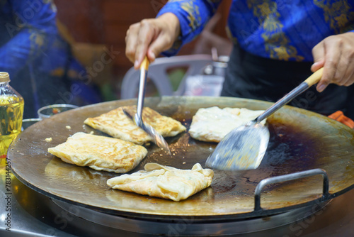 Crispy Roti Vendor at the Street Corner © ake1150
