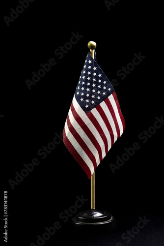 table top USA flag isolated on black background