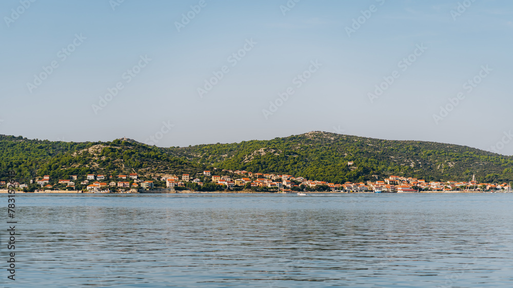 Village houses with red roofs on seashore of Adriatic Sea, Dugi Otok island, Croatia
