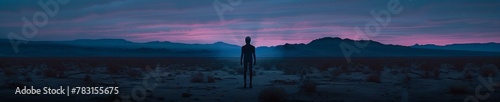 Area 51's quiet expanse, a single alien figure casting an eerie glow