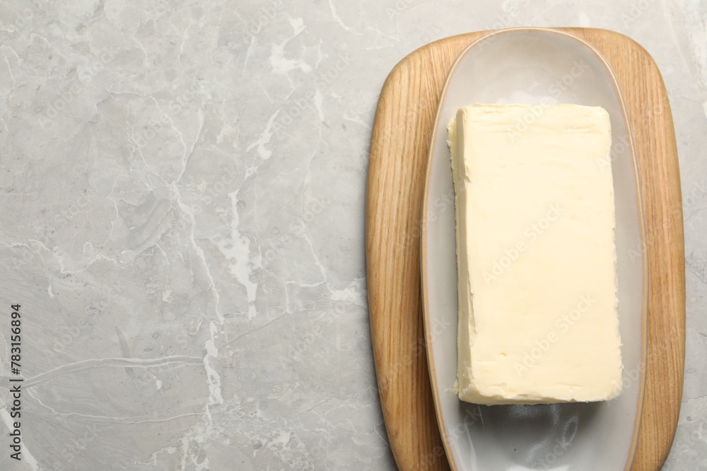Block of tasty butter on grey table, top view. Space for text Block of tasty butter on grey table, top view. Space for text