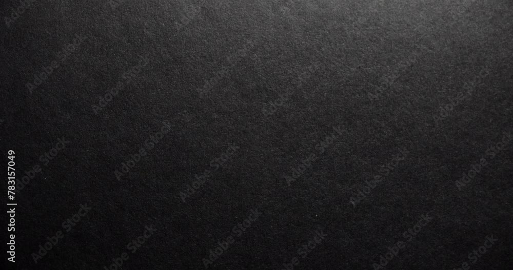Texture of velvet black paper. Black rough paper surface, slow moving. Texture of velvet black paper. Black rough paper surface, slow moving.