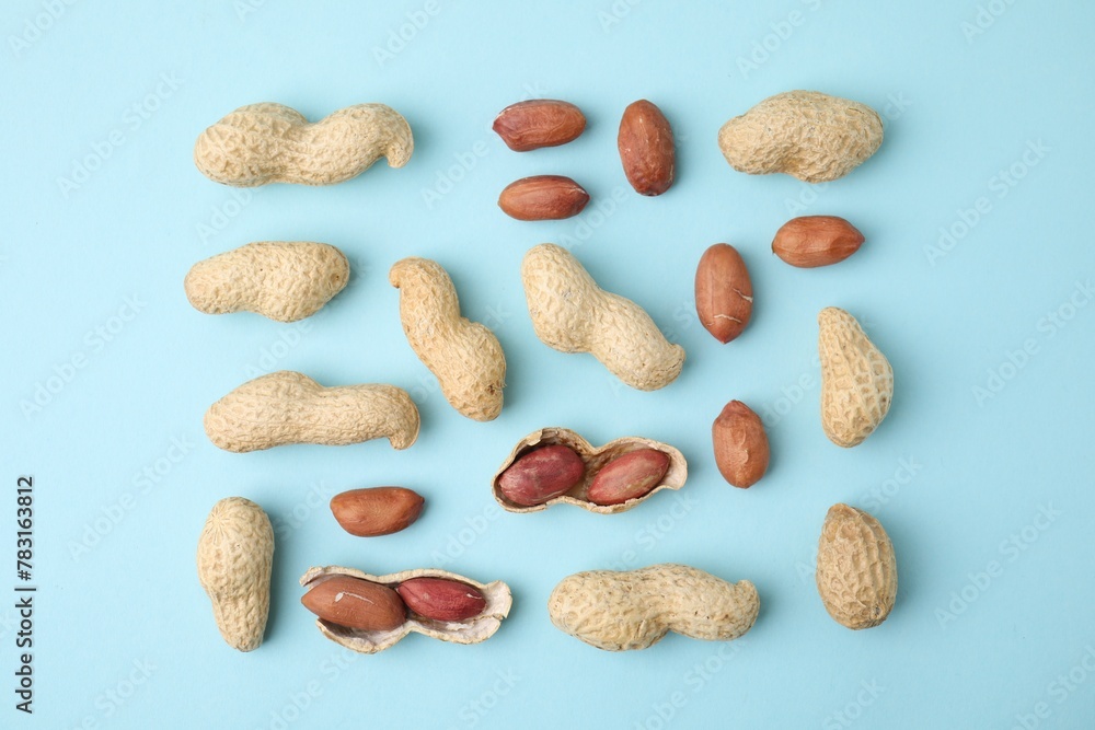 Fresh peanuts on light blue table, flat lay Fresh peanuts on light blue table, flat lay
