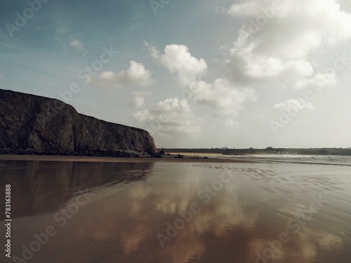 Fototapeta Naklejka Na Ścianę i Meble -  Beach in northern France with the low tide, the cliffs and the reflection of the clouds on the sand.