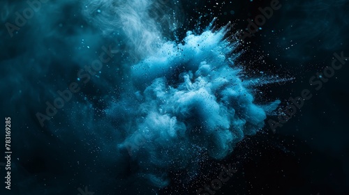 Blue powder explosion isolated on black background photo