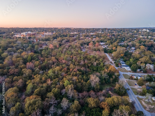 Aerial landscape of forest and suburbanarea road at sunset in Augusta Georgia photo