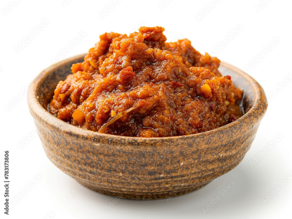 Sambal isolated on white background. It is made from chilies that have been finely ground and then cooked in a stir-fry.