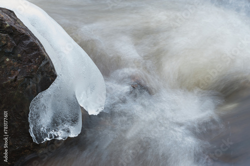 Ice on a rock with a white background photo