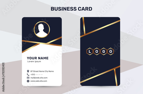The business card uses a golden color accent to give a sense of luxury and premium quality. With a dark and white background, it has a simple and modern design that suits the corporate identity style