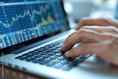 Professional Hands Analyzing Financial Data on Laptop Screen in Bright Office Environment