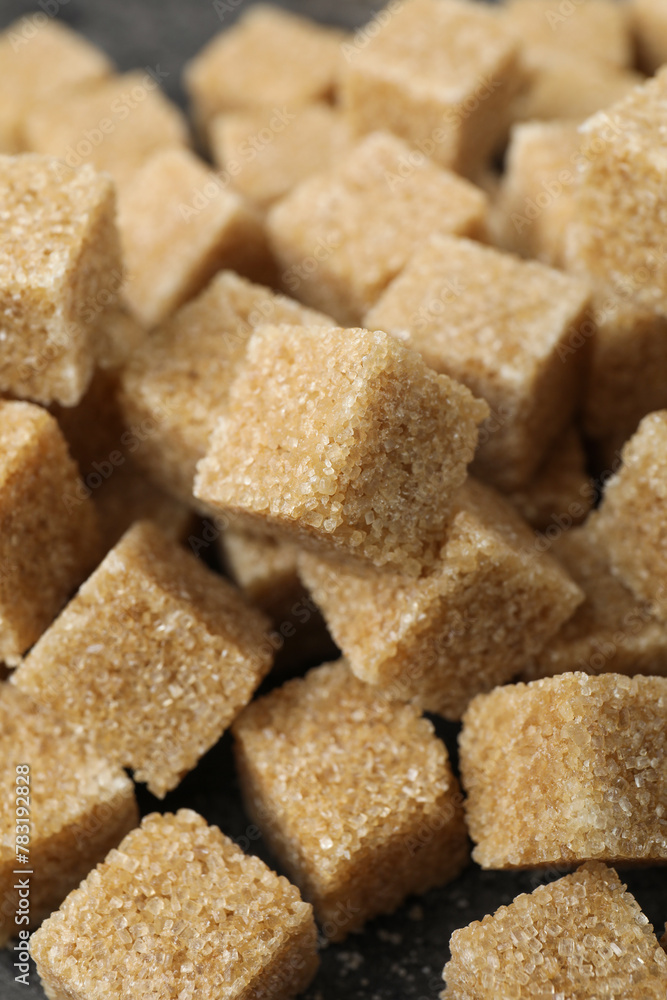 Brown sugar cubes on table, closeup view Brown sugar cubes on table, closeup view