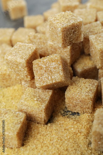 Brown sugar cubes on table, closeup view