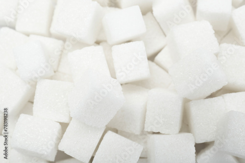 White sugar cubes as background, top view