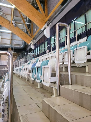 side view, chairs, rows, plastic. tribune, places for figure skating and hockey fans, object 