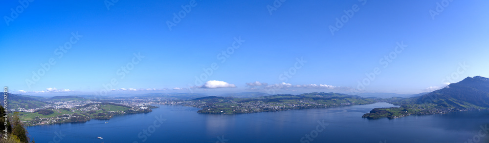 Wide angle panoramic view over Swiss Lake Lucerne seen from viewpoint Bürgenstock at Swiss alp on a sunny spring morning. Photo taken April 11th, 2024, Ennetbürgen, Switzerland. Wide angle panoramic view over Swiss Lake Lucerne seen from viewpoint Bürgenstock at Swiss alp on a sunny spring morning. Photo taken April 11th, 2024, Ennetbürgen, Switzerland.
