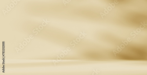 Empty cream beige golden room studio with shadow of leaves for product presentation. Autumn background. Summer tropical backdrop. Cosmetic showroom.	