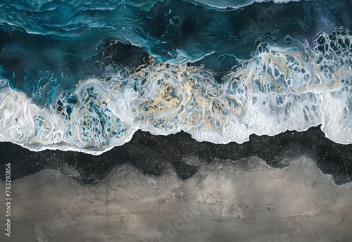 A mesmerizing aerial view of electric blue waves crashing on the sandy beach photo