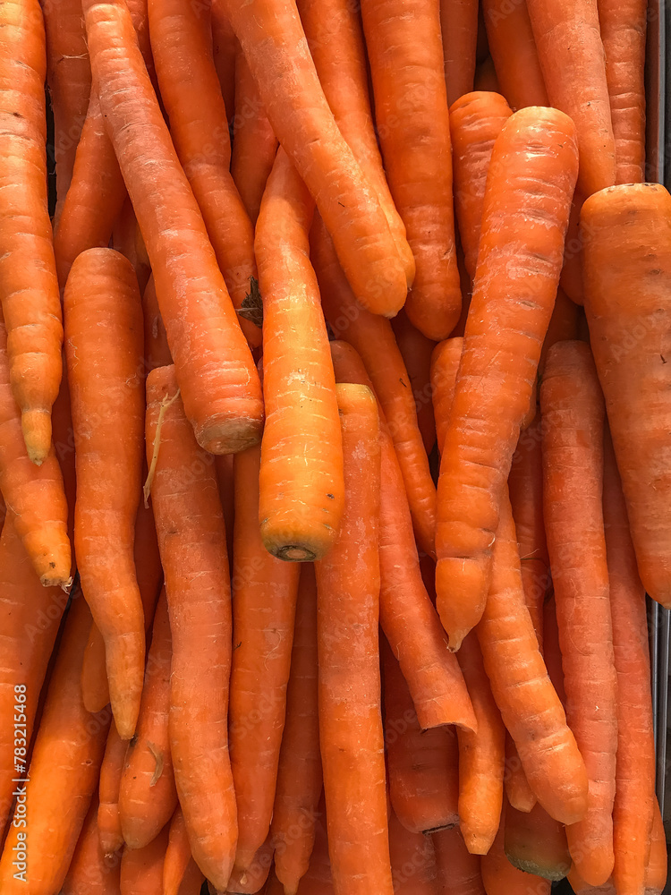 Fresh carrots presented in bulk for sale at the market and supermarket. Fresh carrots presented in bulk for sale at the market and supermarket.