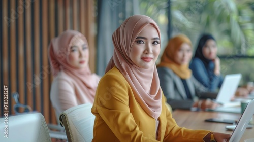 Hijab-clad businesswomen demonstrate professionalism and expertise in the meeting