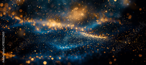 Abstract ocean of particles with golden highlights on blue