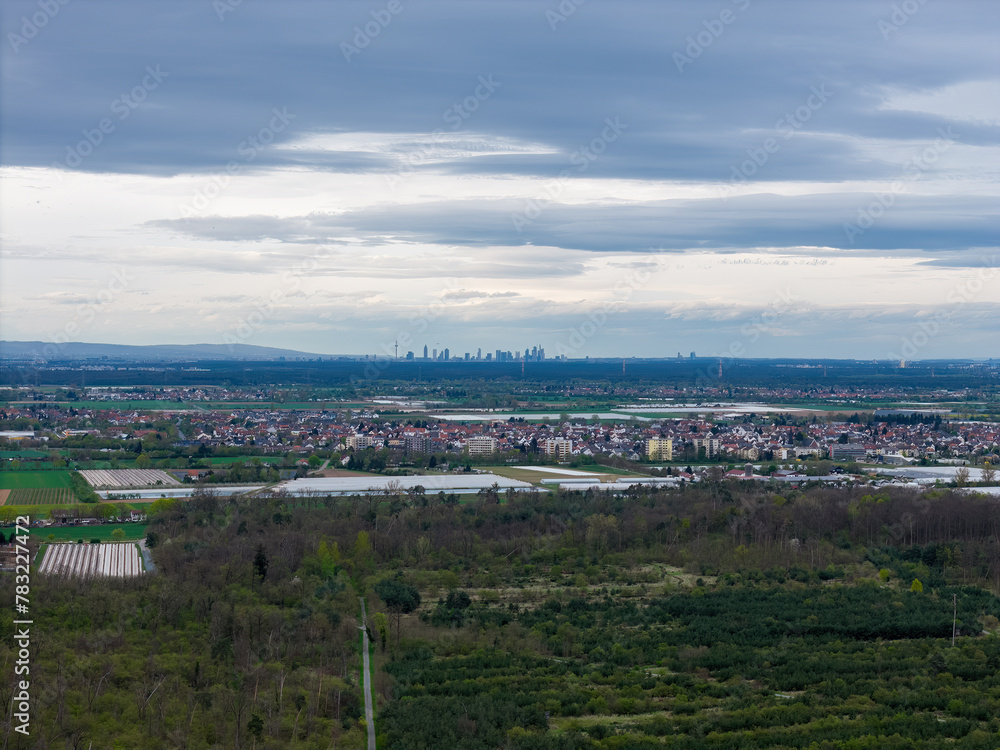 Frankfurt skyline behind fields and landscape in spring