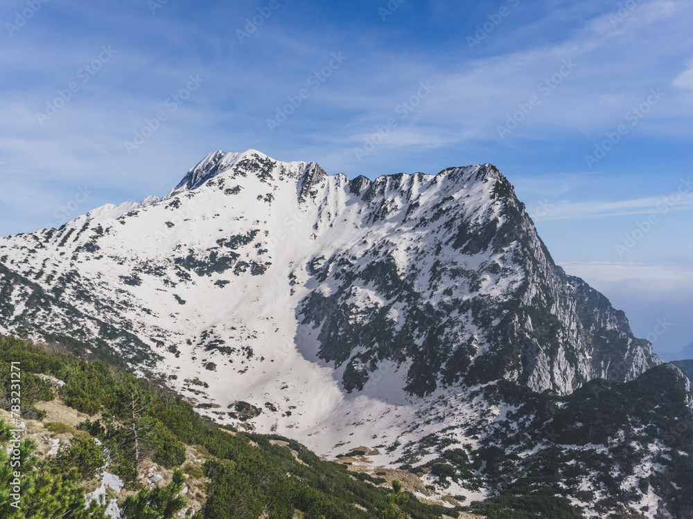 Snow covered mountain in the italian alps on a sunny winter day Snow covered mountain in the italian alps on a sunny winter day