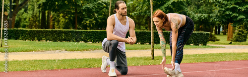 A determined woman in sportswear practice sport with personal trainer on a sunny day outdoors.