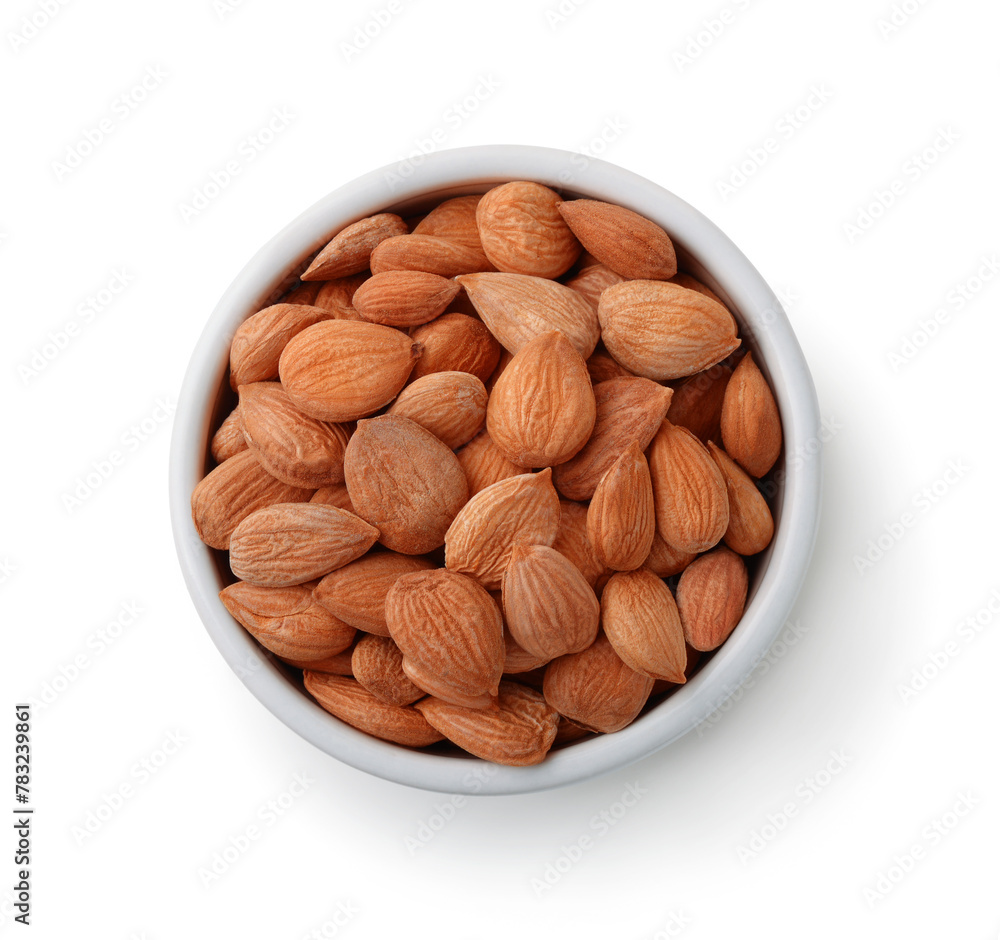Peeled apricot kernels in ceramic bowl Peeled apricot kernels in ceramic bowl
