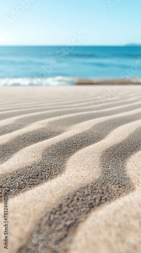 Abstract beach background  clear and soft blue sky with smooth fine sand of delicate color. In the foreground of the painting is a large area of       beige fine sand with wavy ripples on it.