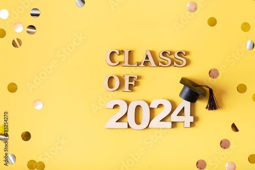 Golden glitter number 2024 with graduated cap. Class of 2024 concept.