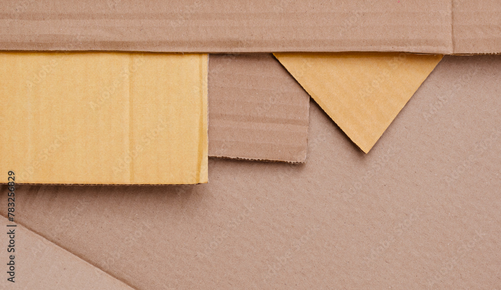 Part of 5 Cardboard sheets stacked in geometric pattern background in table top view, Flat lay with copy space Part of 5 Cardboard sheets stacked in geometric pattern background in table top view, Flat lay with copy space