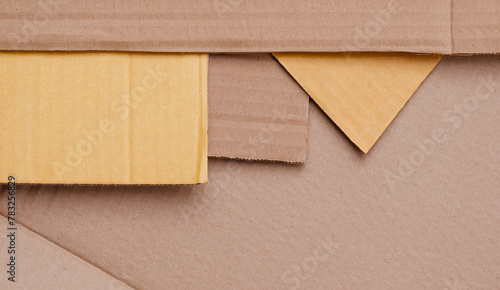 Part of 5 Cardboard sheets stacked in geometric pattern background in table top view, Flat lay with copy space 