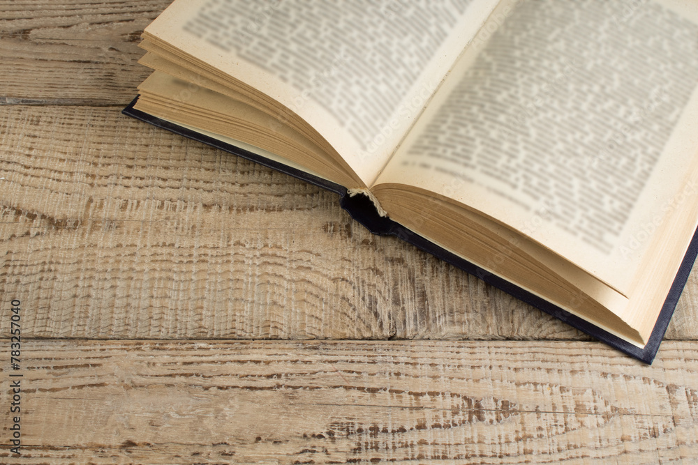 Obraz premium open book on a wooden table. Back to school. Education business concept.
