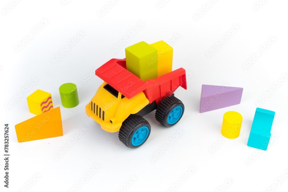 Top view of colorful wooden bricks on the table. Early learning. Educational toys on a white background. Top view of colorful wooden bricks on the table. Early learning. Educational toys on a white background.