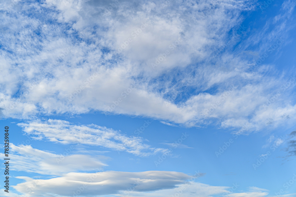 White clouds in a bright blue sky. The beauty of the nature White clouds in a bright blue sky. The beauty of the nature