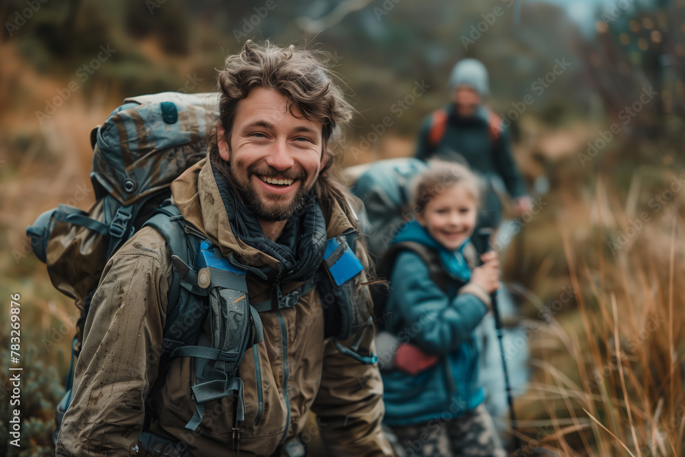 A family hiking in nature together enjoys an outdoor adventure.