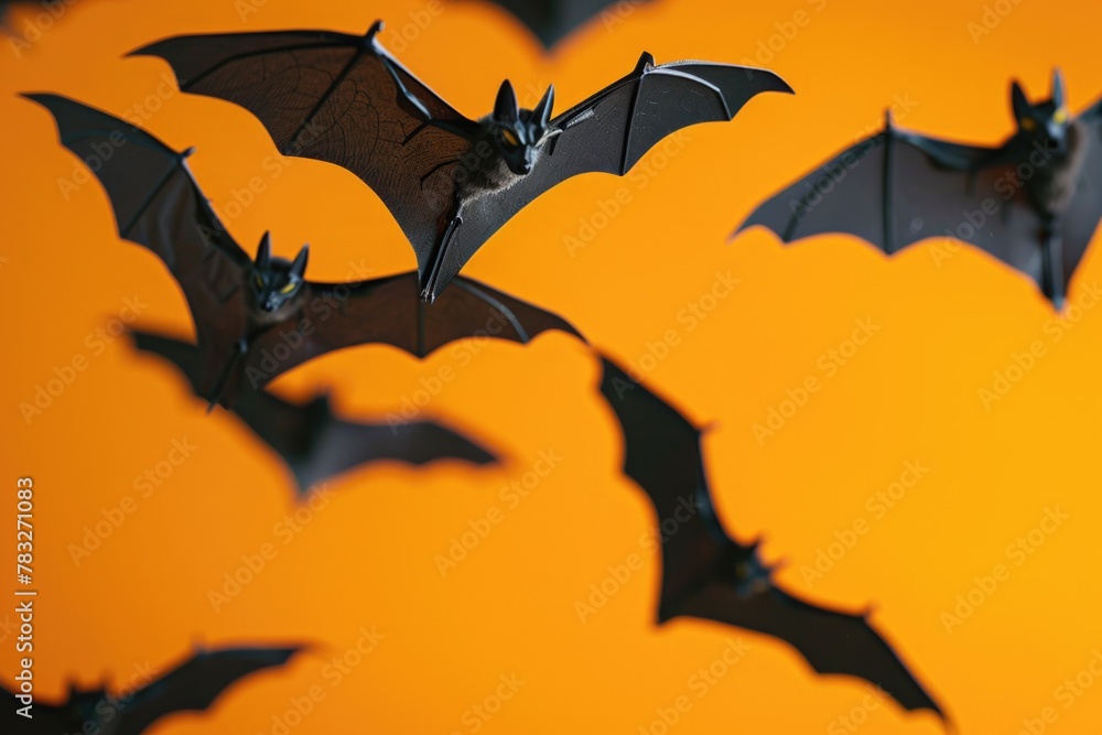 A group of bats in flight, suitable for Halloween themes