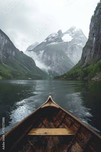 Boat sailing on water with mountains background © BrandwayArt