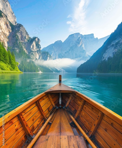Wooden boat on lake with mountains