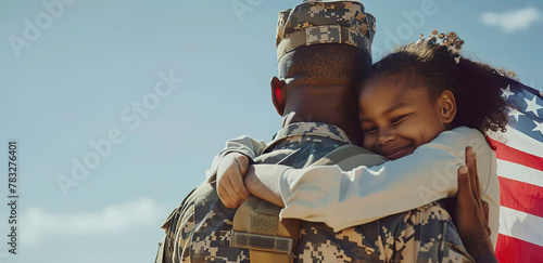 Photo of an African American male soldier embracing his daughter after being released from war photo