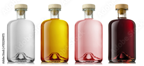 Set of a glass bottle with different color liquids. Isolated on a white background. Gin, vodka, rum, liqueur, whisky.